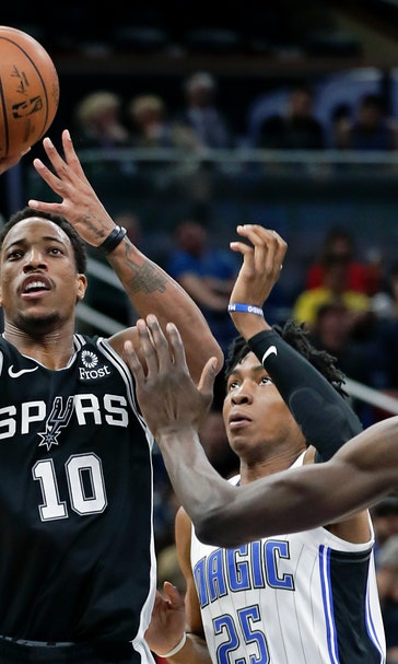Aldridge nets 20, hot-shooting Spurs rout Magic 129-90